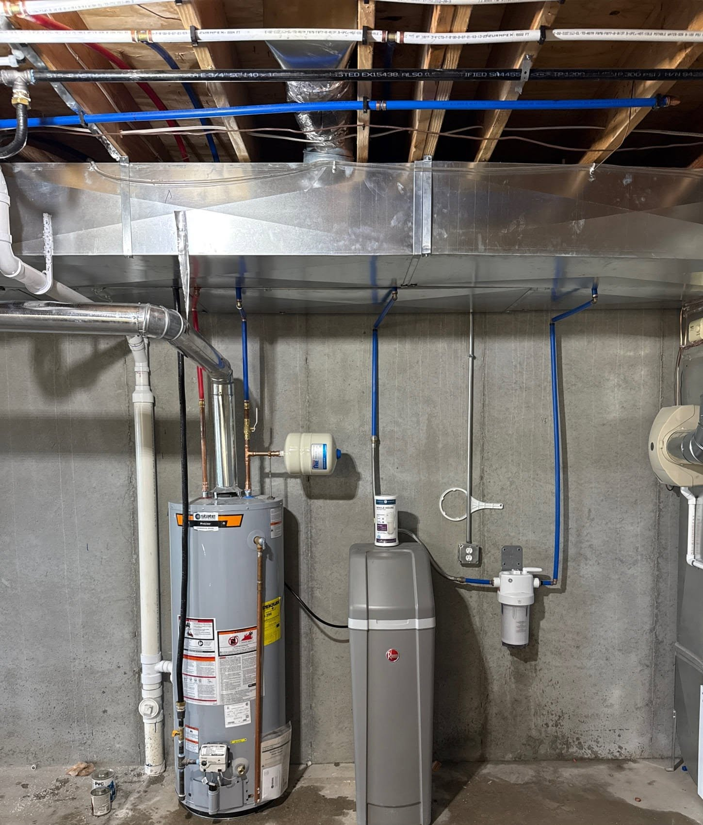 Technician inspecting gas line connections and safety valves